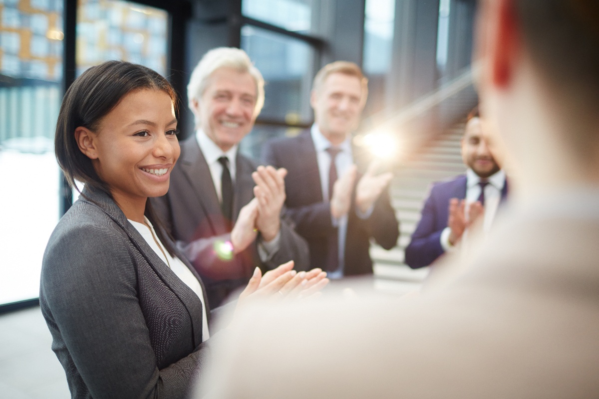 public-sector-group-of-coworkers-suits-smiling-clapping.jpg-2